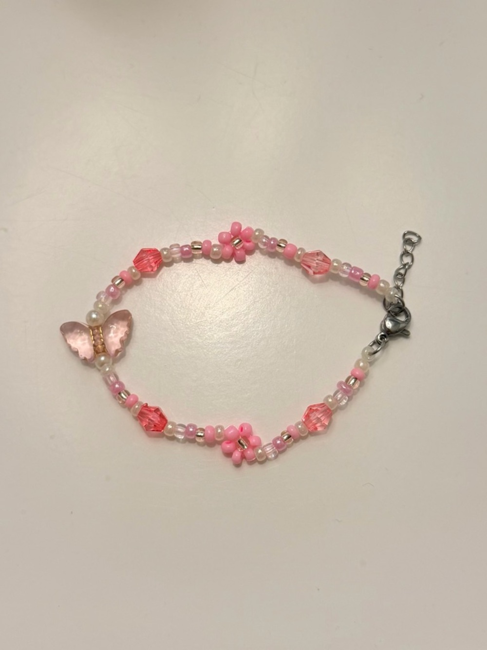 Homemade Pink Beaded Butterfly Bracelet with Flower Accents